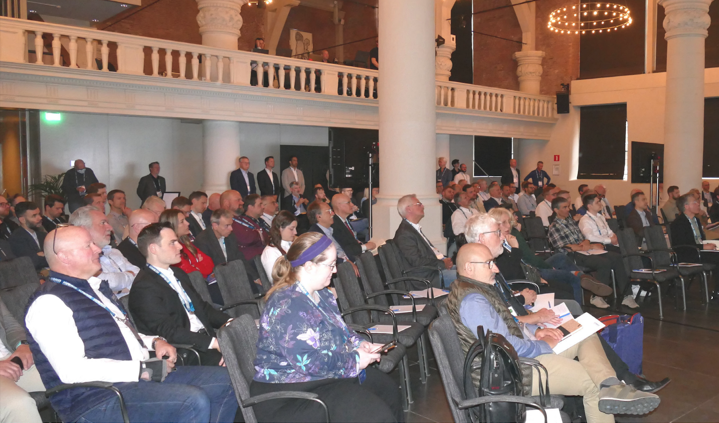 Audience attentively listens during business conference Hybrid Fusion 2025