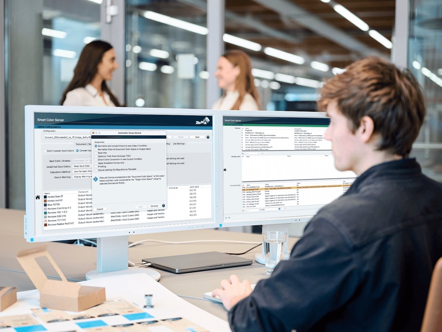 Person using ZePrA on dual monitors in an office.